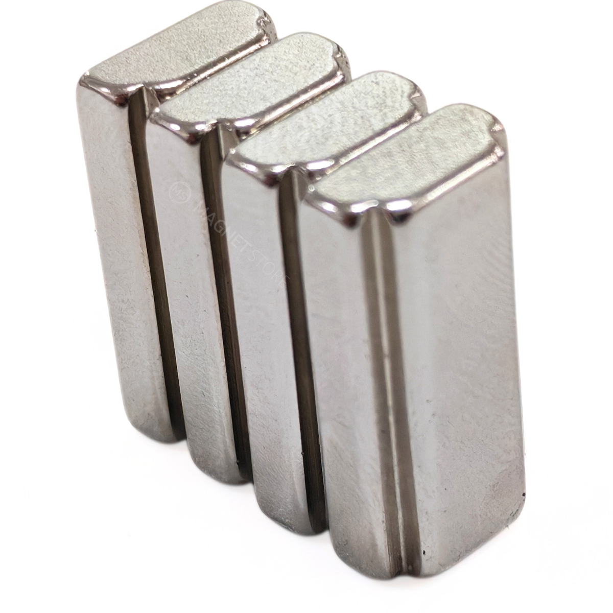 16/13 × 5/4 × 10 mm N42 Neodymium Step Block Magnet . Rectangular Nickel-coated neodymium magnet with a small step on the top sides.Sold at Magnet Store South Africa, Online and in store. Group of 4 magnets.
